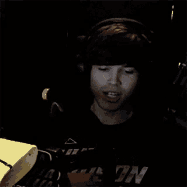 a man wearing headphones and a shirt that says n on it