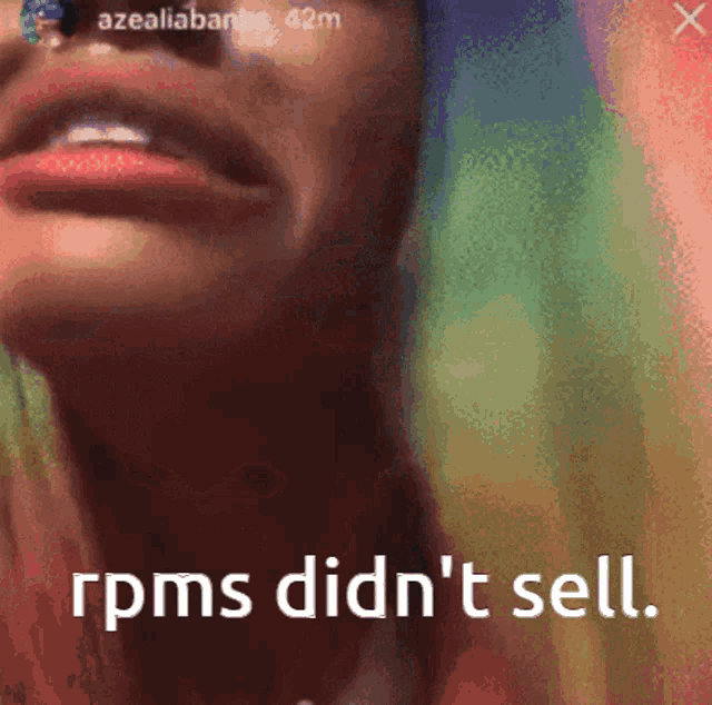 a close up of a woman 's face with the words " rpms did n't sell "