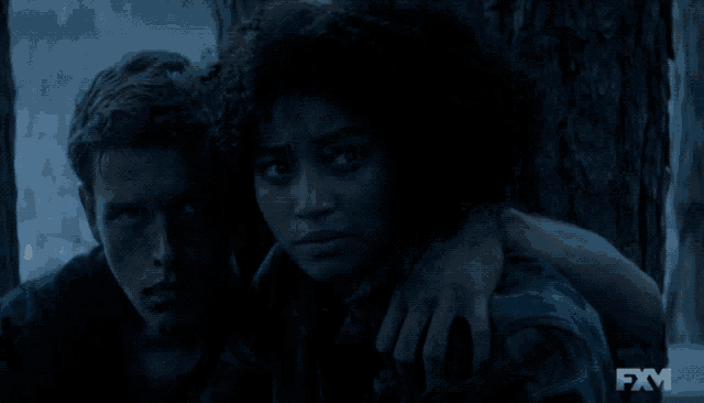 a fxm logo can be seen on a dark background