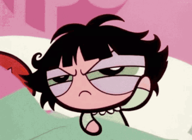 buttercup from the powerpuff girls is laying in bed with a sad face on her face .