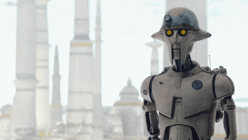 a robot with a helmet on stands in front of buildings