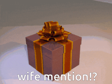a gift box with a gold bow and the words wife mention