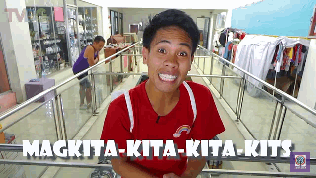 a man in a red shirt with the words magkita-kita-kita-kits