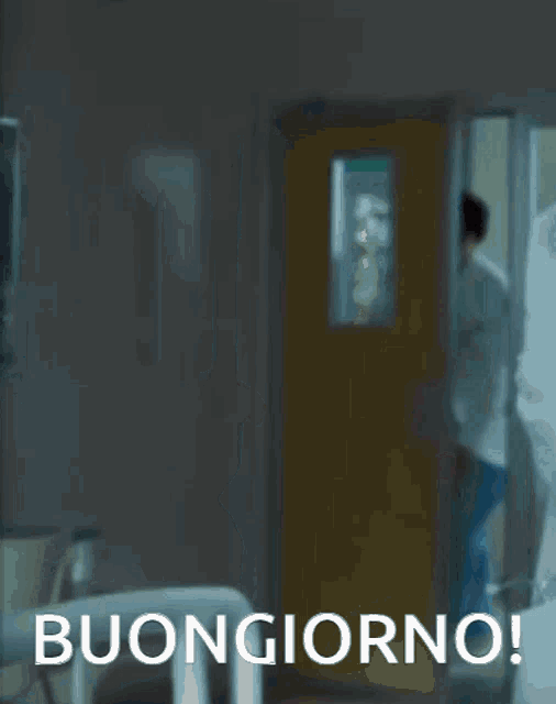 a man in a lab coat is dancing in a hallway with the words buongiorno below him