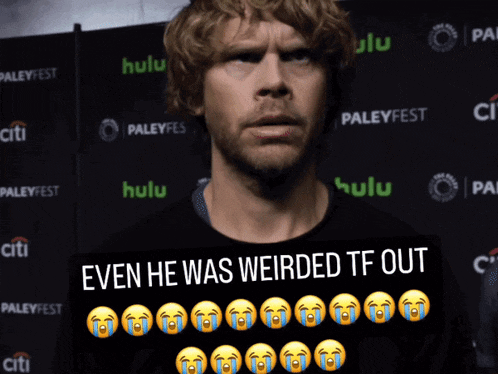a man is holding a sign that says even he was weirded tf out