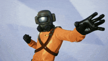 a man wearing a gas mask and gloves reaches out towards the camera