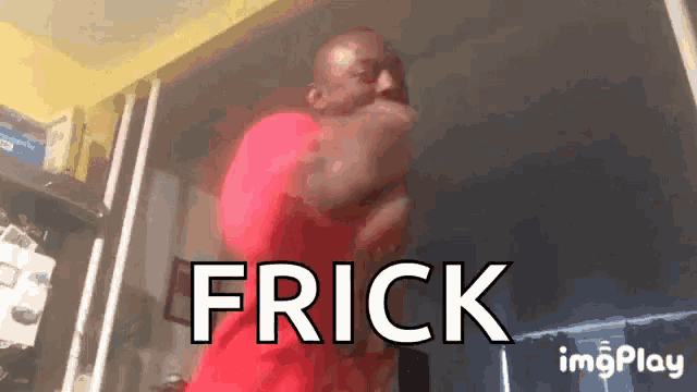 a man in a red shirt is dancing in a room with the word frick written on the screen .