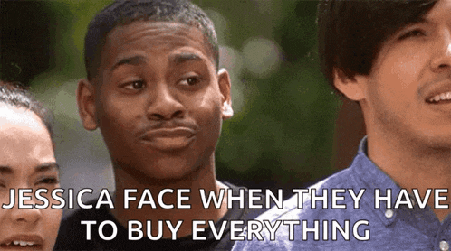 a group of people are standing next to each other and one of them is making a face .