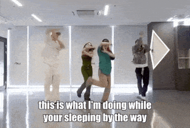 a group of people are dancing in a room with the caption this is what i 'm doing