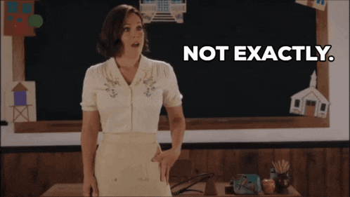 a woman is standing in front of a blackboard with the words not exactly written on it