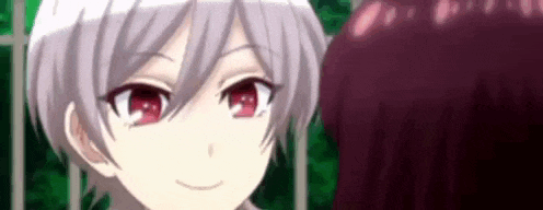a close up of a girl with short white hair and red eyes looking at another girl .