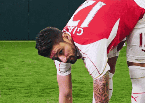 a soccer player with the number 11 on the back of his shirt