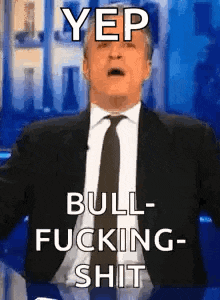 a man in a suit and tie is making a funny face and saying `` yep bull fucking shit '' .