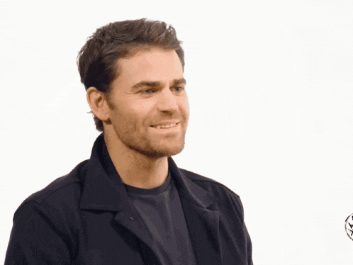 a man wearing a cowboy hat and a leather jacket