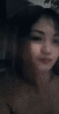 a close up of a woman 's face with a blurry background