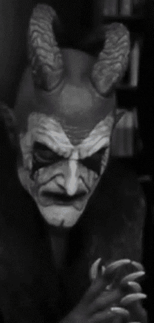 a black and white photo of a demon with horns and the words " i need to destroy monday pretties "