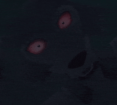 a close up of a wolf with red eyes