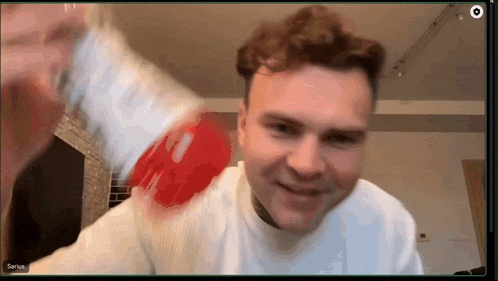 a man on a video call with the name sarius at the bottom of the screen