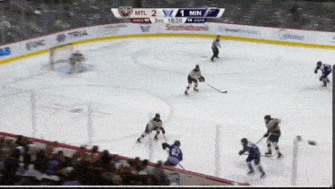 a hockey game is being played between the montreal maple leafs and the toronto maple leafs