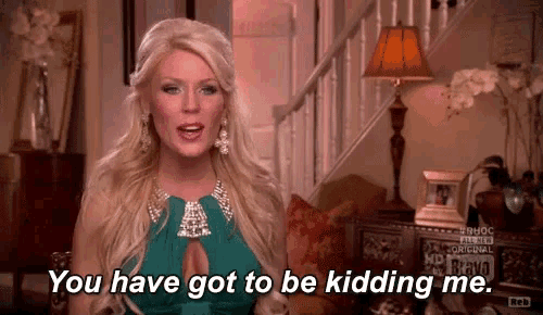a woman in a green dress says you have got to be kidding me .