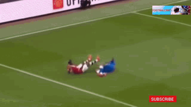 a soccer game is being played on a field with a subscribe button on the bottom