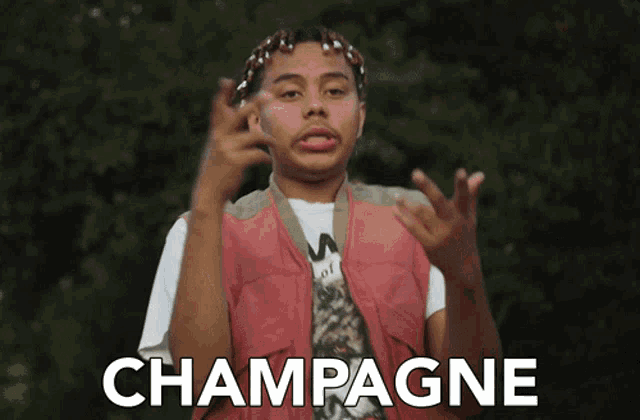 a man wearing a pink vest and a white shirt is making a funny face and says champagne