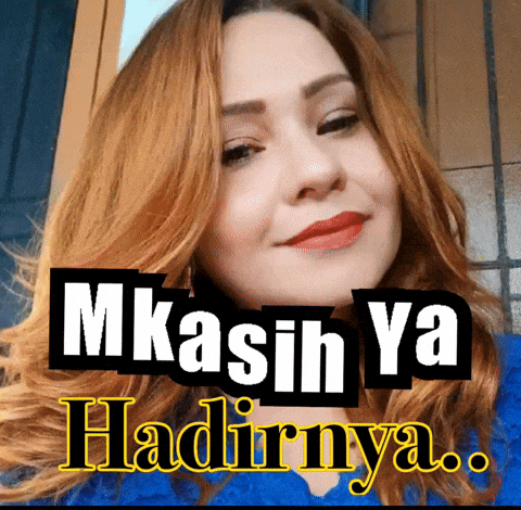 a woman with red hair is smiling with the words mkasih ya hadirnya