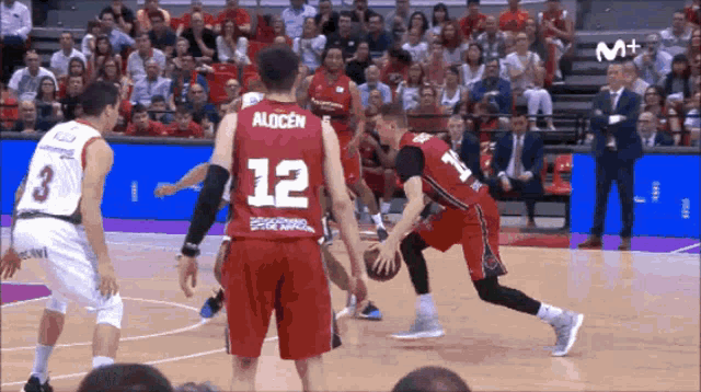 basketball player wearing a red jersey with the number 12 on it