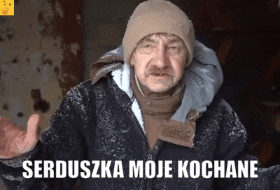 a man wearing a beanie and a jacket with the words serduszka moje kochane written on it