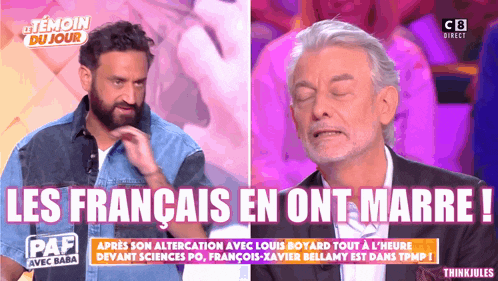 a man with a beard is talking to another man with the words les francais en ont marre on the screen