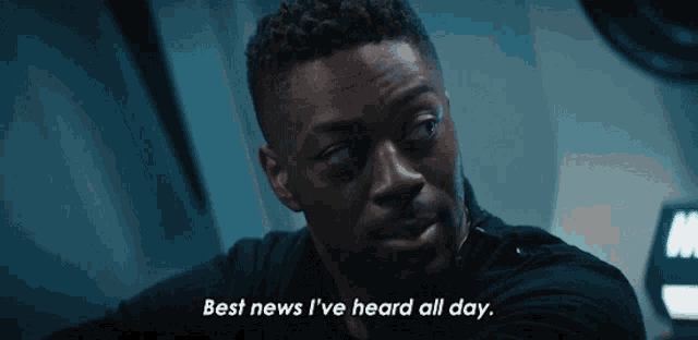 a man says " best news i 've heard all day " in a dark room