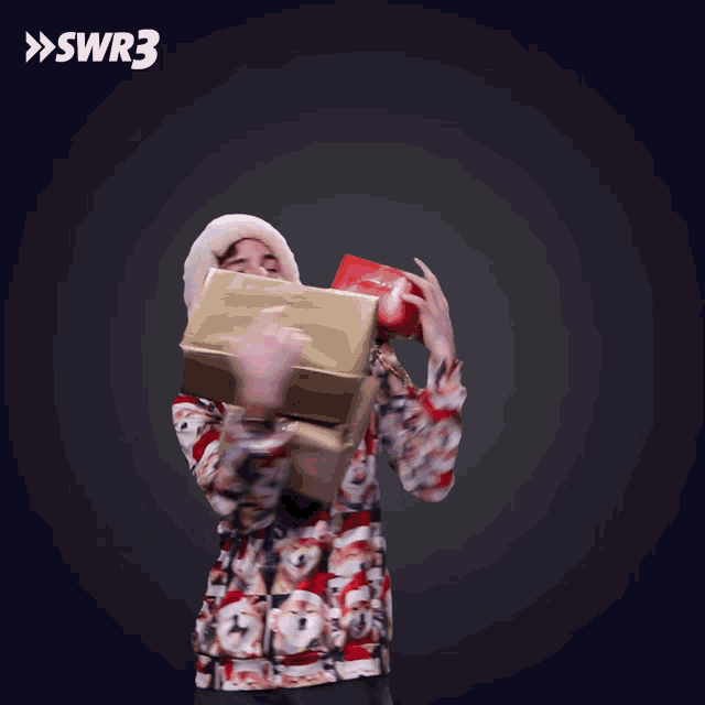 a man wearing a santa hat and a sweater with swr3 on the bottom