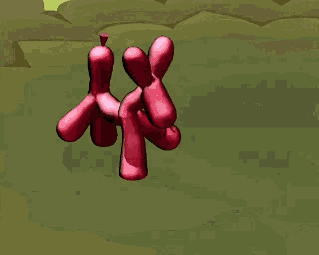 a pink balloon dog is flying in the air