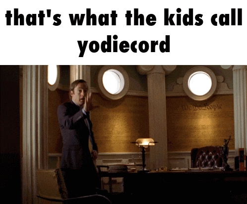 a man in a suit stands in front of a wall that says " that 's what the kids call "