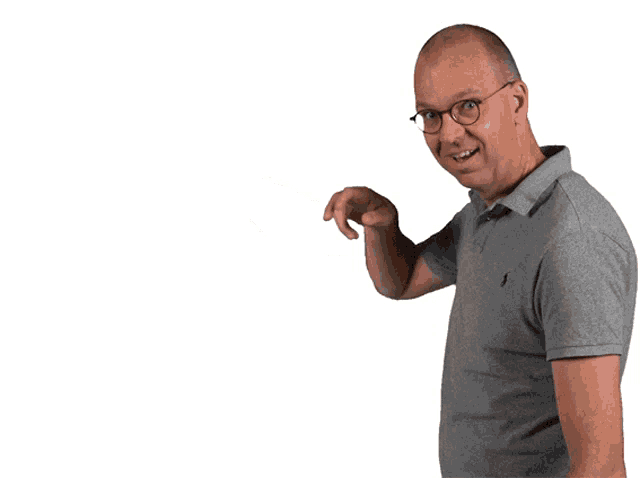 a man wearing glasses and a grey polo shirt points to the side