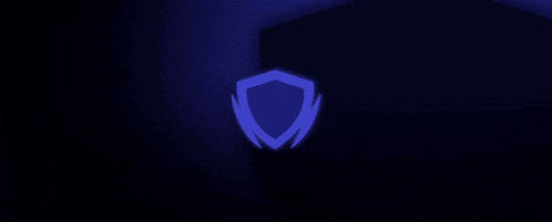 a blurry picture of three blue lights on a dark background