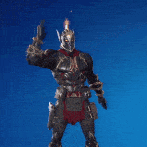 a man in a knight 's armor is holding a gun in his hand .