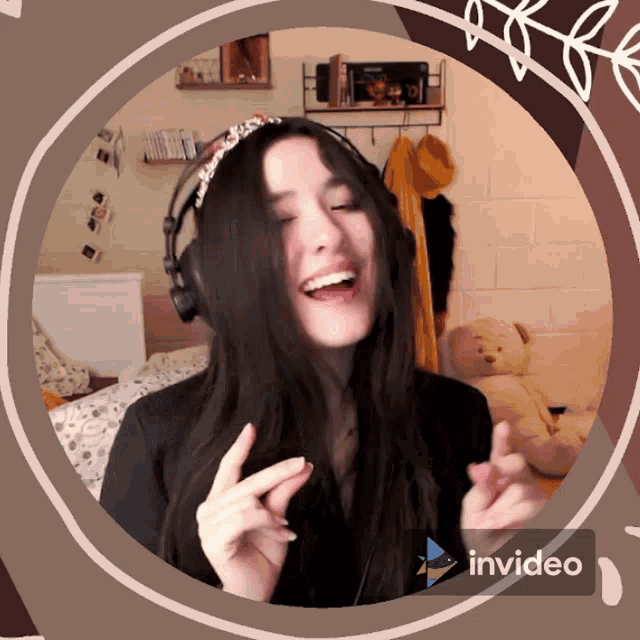 a woman wearing headphones is smiling in a circle with invideo written on the bottom