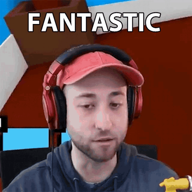 a man wearing headphones and a red hat has the word fantastic written above him