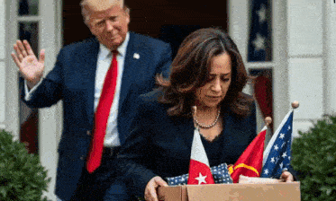 a man and a woman are standing in front of a flag