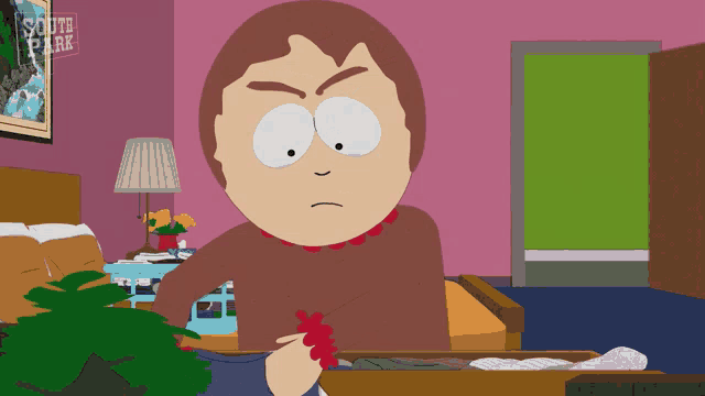 a cartoon character from south park sitting in a bedroom