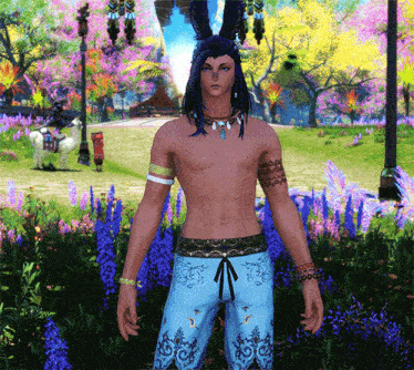 a man without a shirt is standing in a field with purple flowers