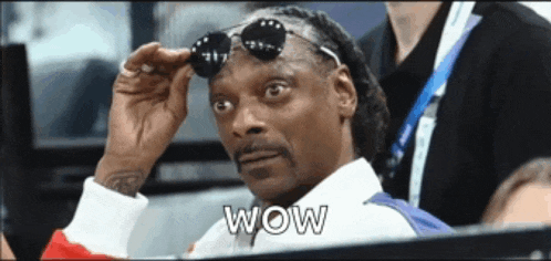 snoop dogg is wearing sunglasses and the word wow is on his face