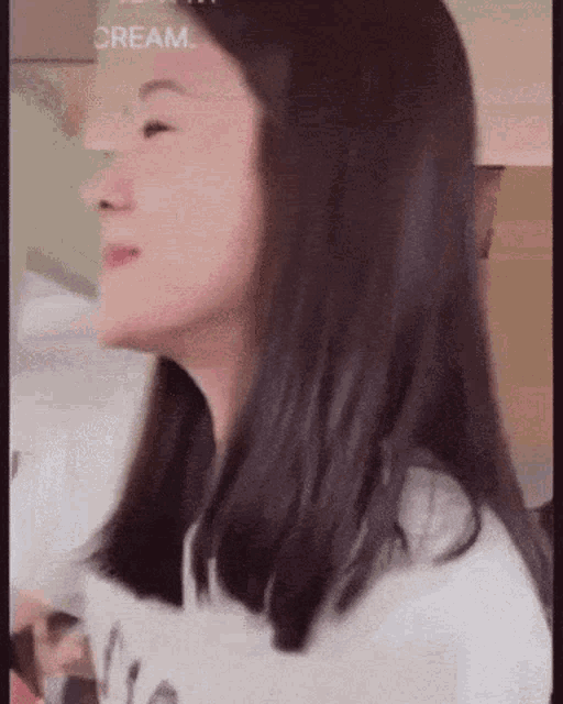a close up of a woman 's face with the word cream visible