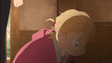 a girl with blonde hair and a pink hoodie is making a funny face
