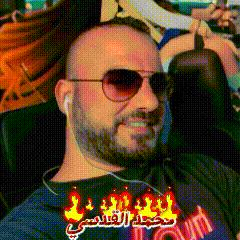 a man with a beard wearing sunglasses and a shirt that says town