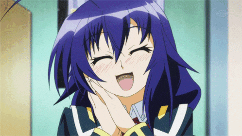a girl with blue hair is smiling with a tvtokyo logo in the corner