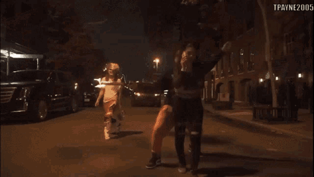 a video of a man with flames on his head says " hold up baby ah ooh "