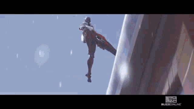 a man is flying through the air while holding a sword .