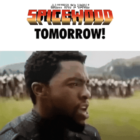 a man stands in front of a banner that says spicehood tomorrow